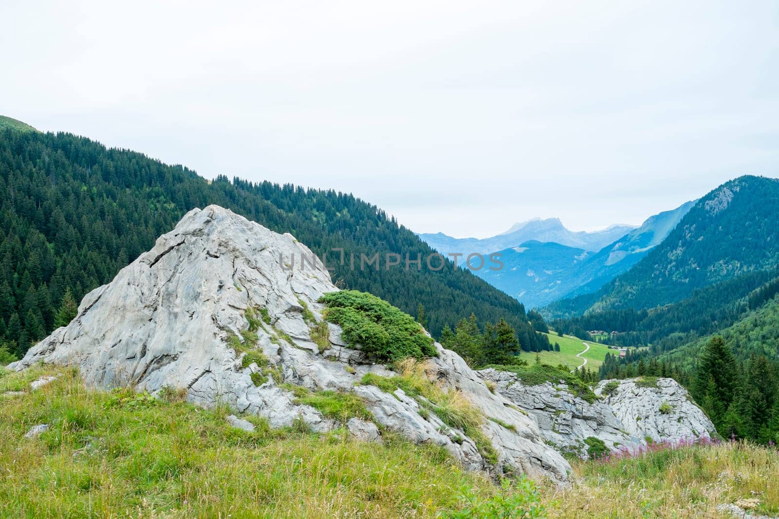Bolder with La Rollaz valley in the background, one of the stages in the Mont Blanc Tour.