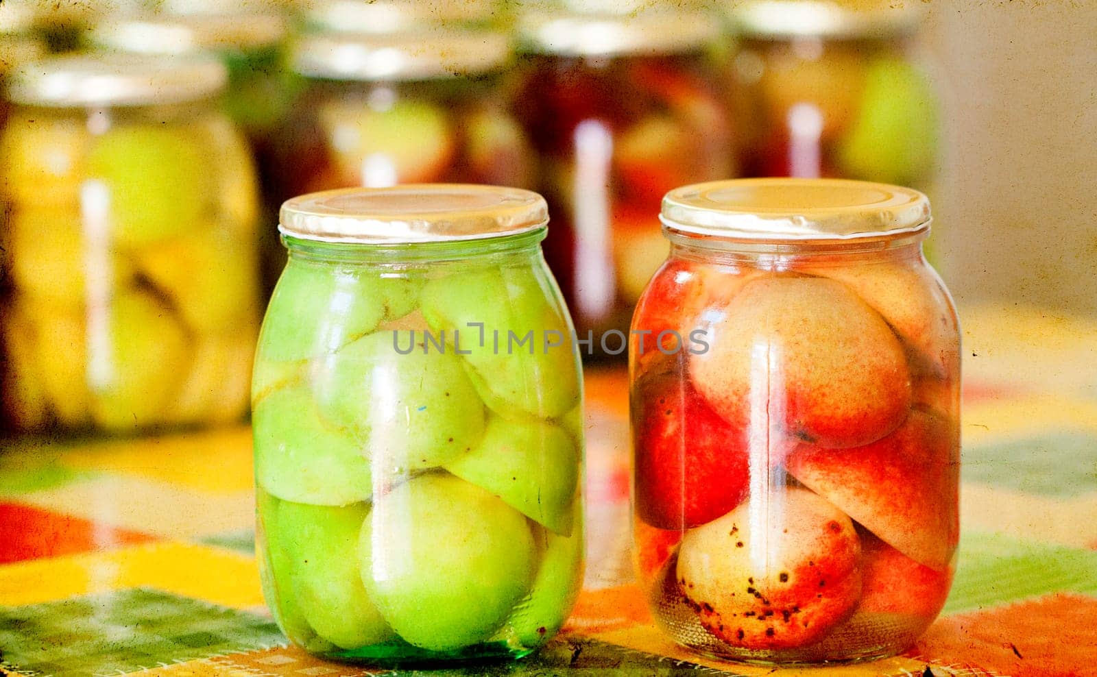 Jars of homemade fruit preserves - peach compote