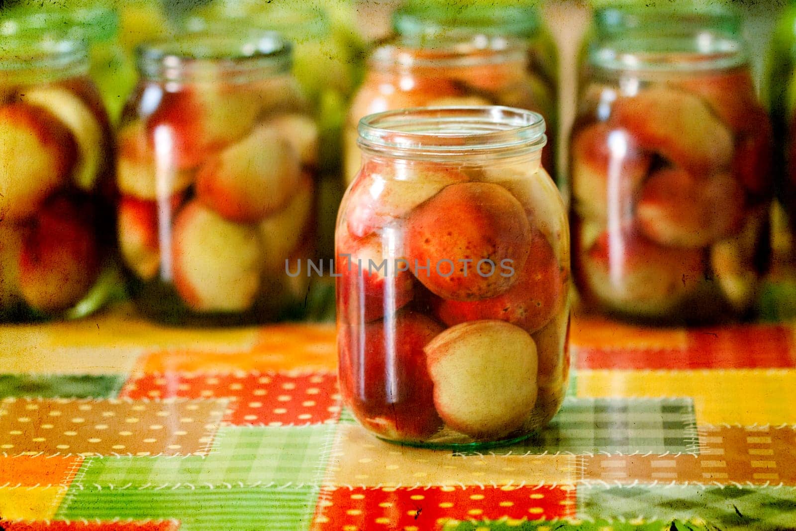 Jars of homemade fruit preserves - peach compote