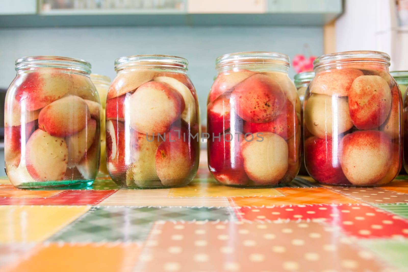 Jars of homemade fruit preserves - peach compote