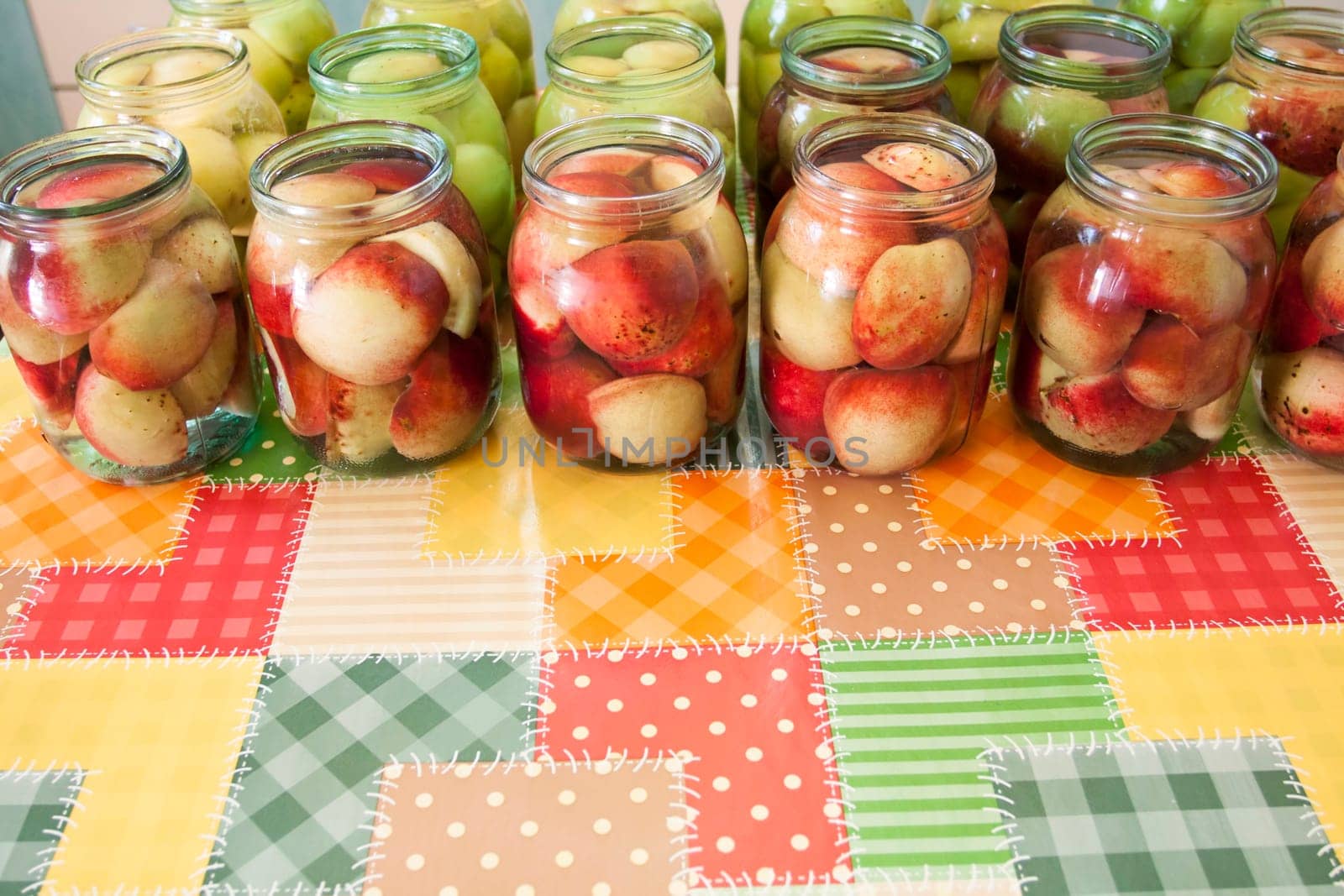 Jars of homemade fruit preserves - peach compote