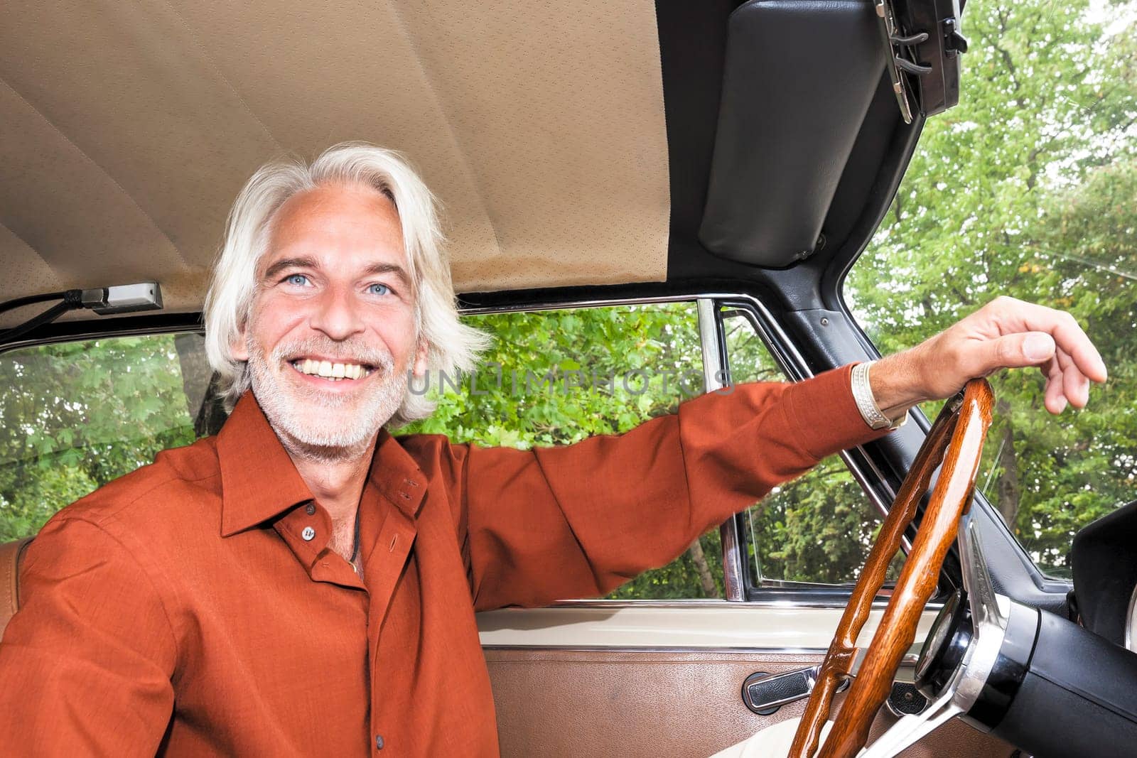 An image of a nice man in his car