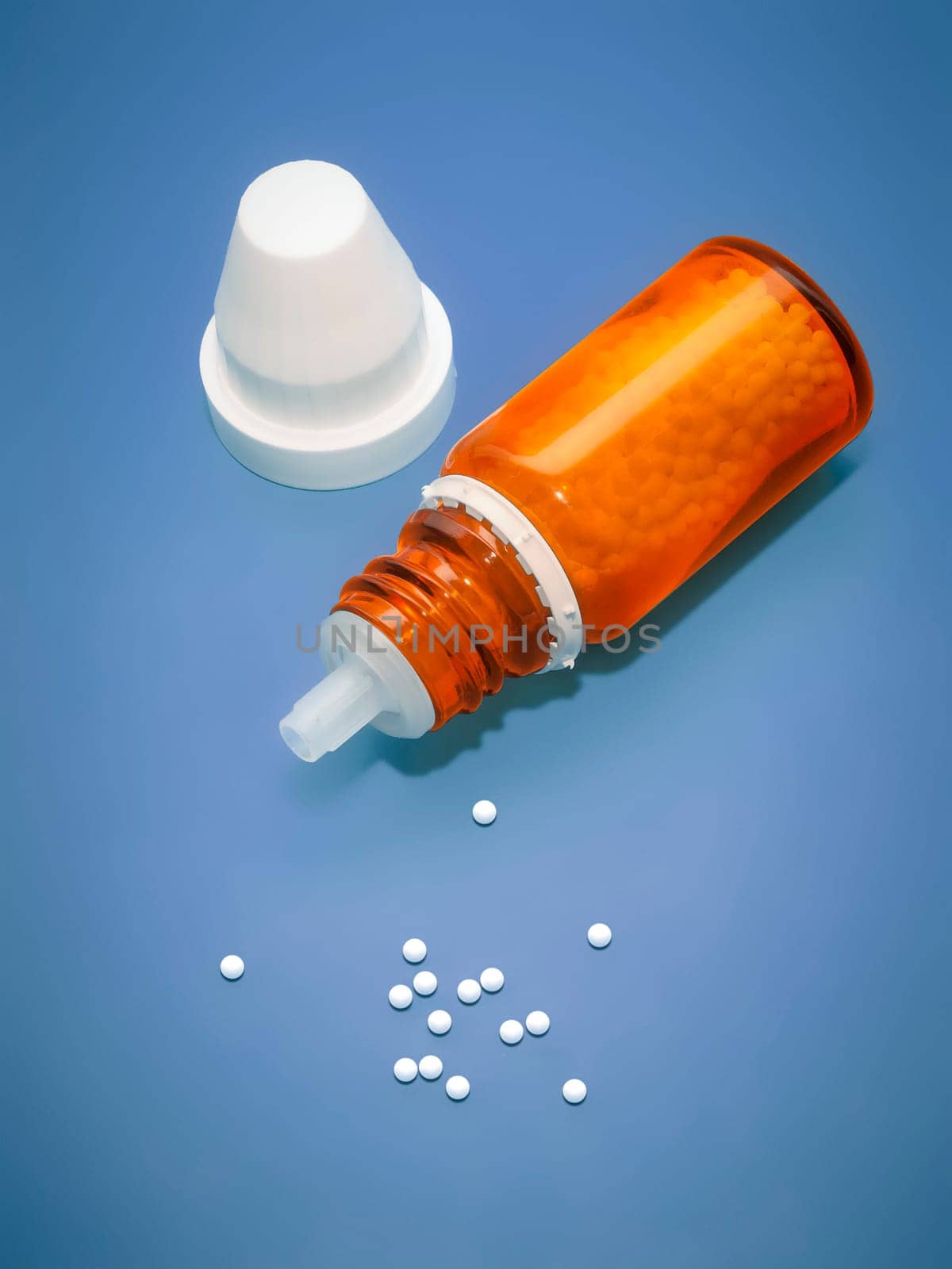 An image of a homeopathic medicine bottle with tablets