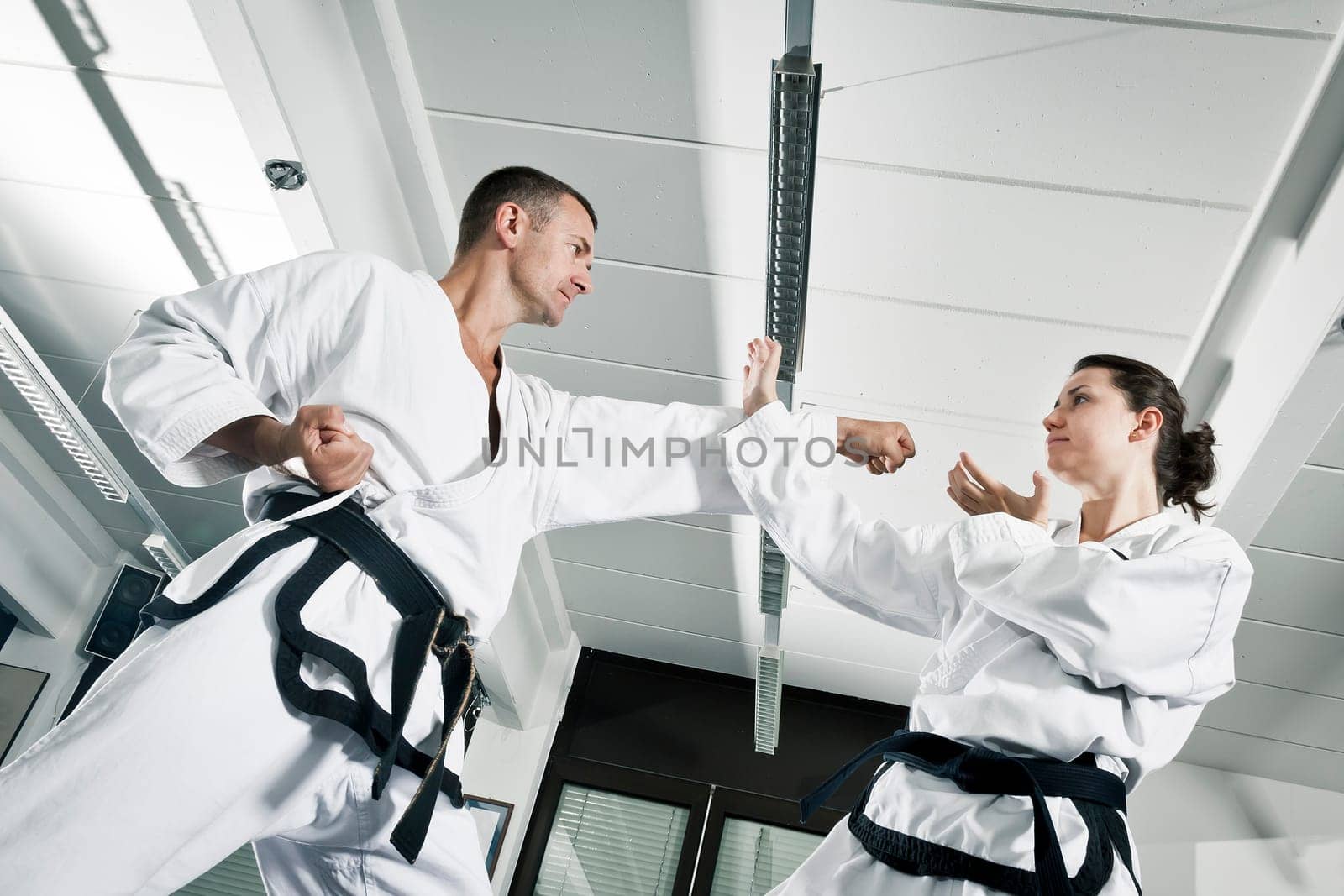 An image of a woman and a man fighting
