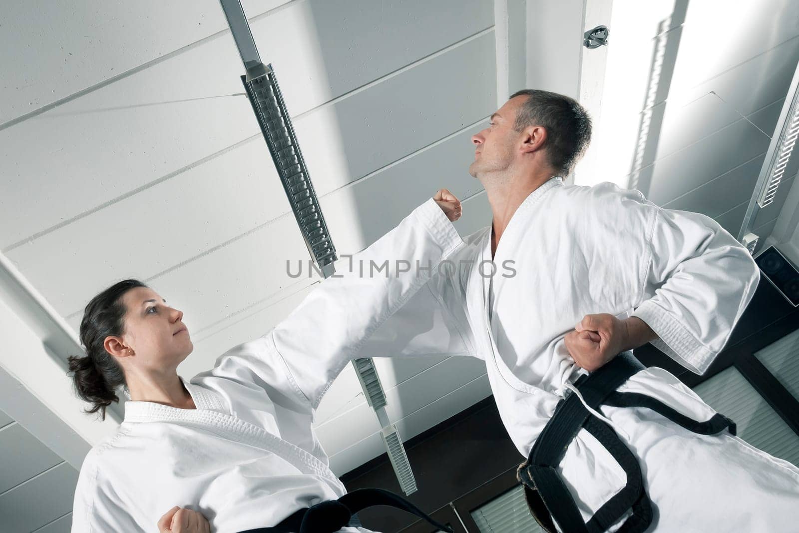 An image of a woman and a man fighting