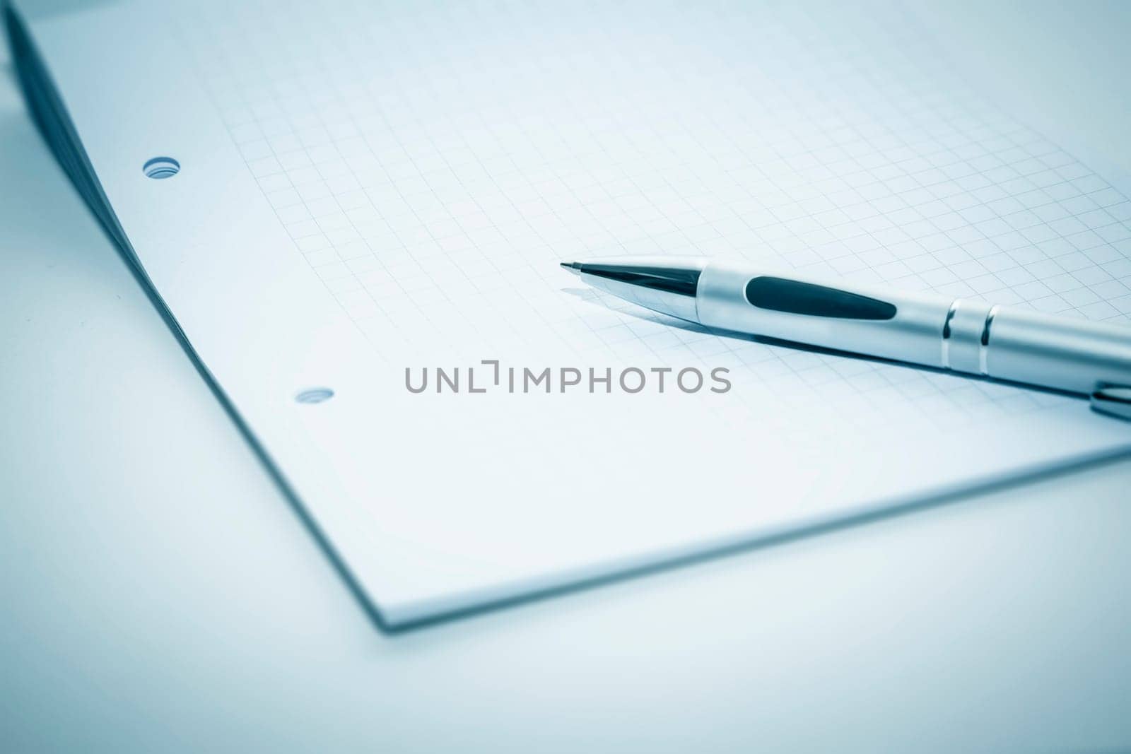 An image of a notepad and a ballpen