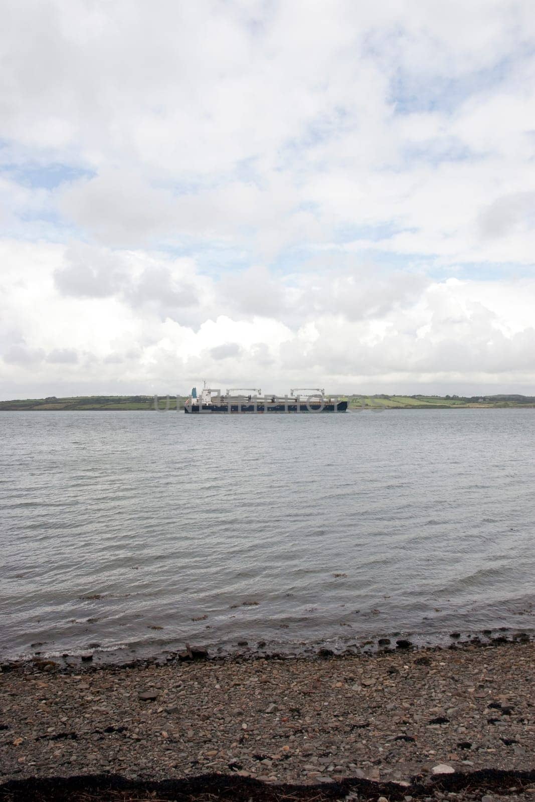 cargo ship with windmill parts on its journey through Youghal harbour county Cork Ireland