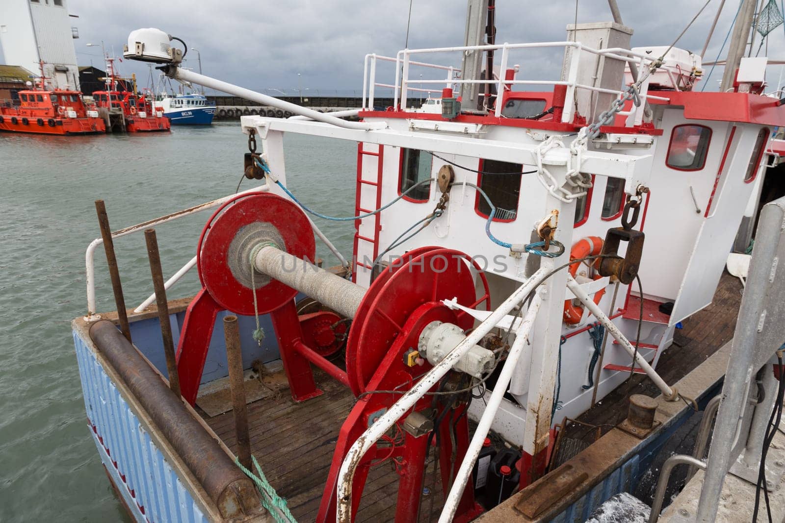 Stern of a fishing boat with rope drum and cabin