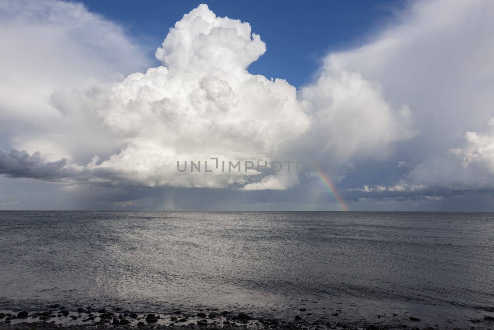 A huge pile cloud rises high above the Baltic Sea