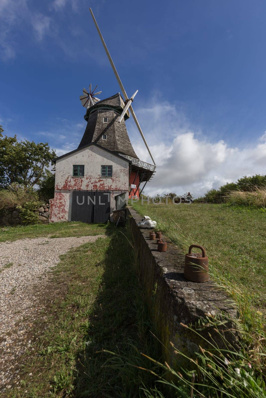 Windmill with miller's house and a garage. Weights on the wall