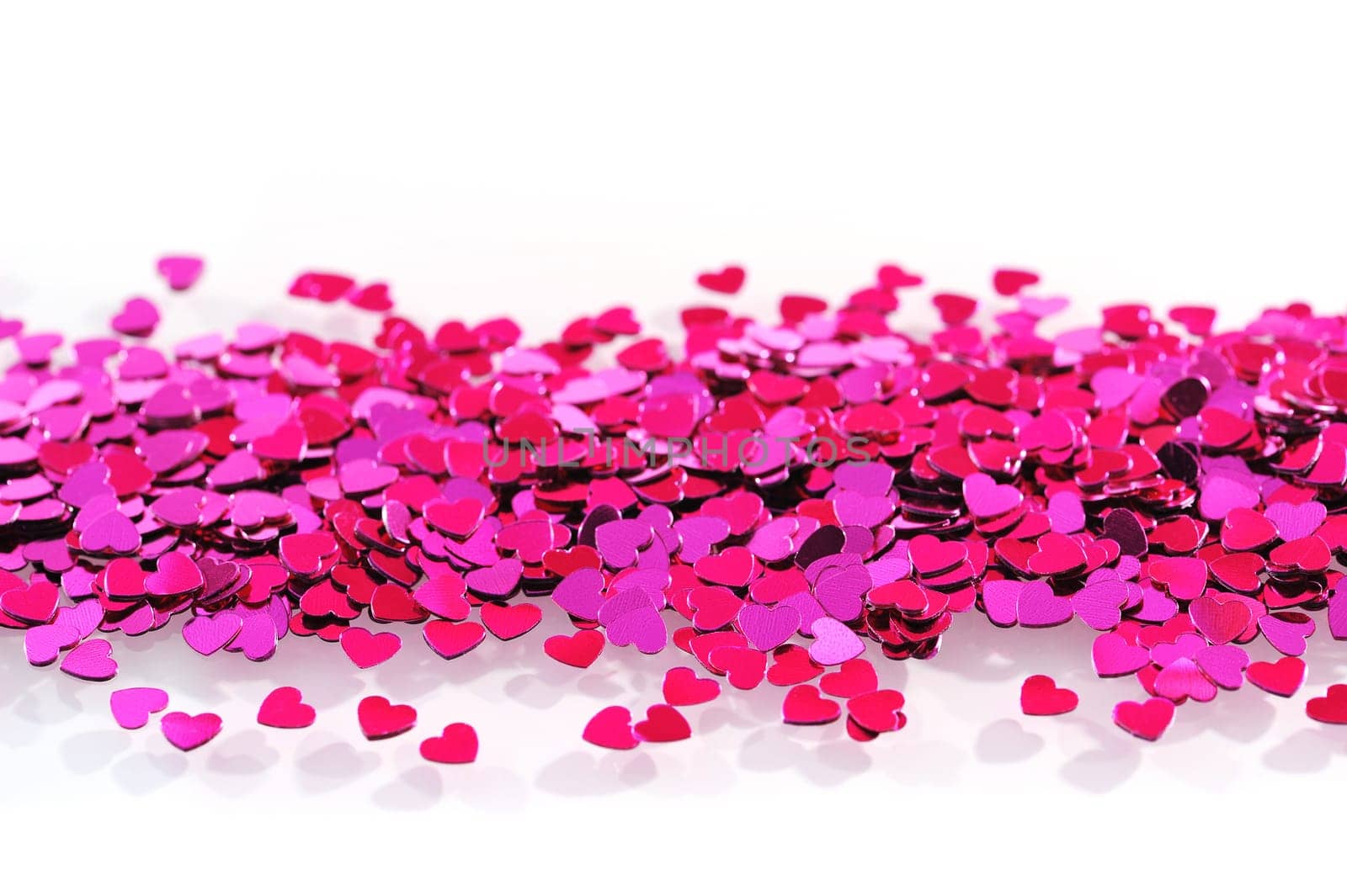 Detailed view of many small pink glitter hearts