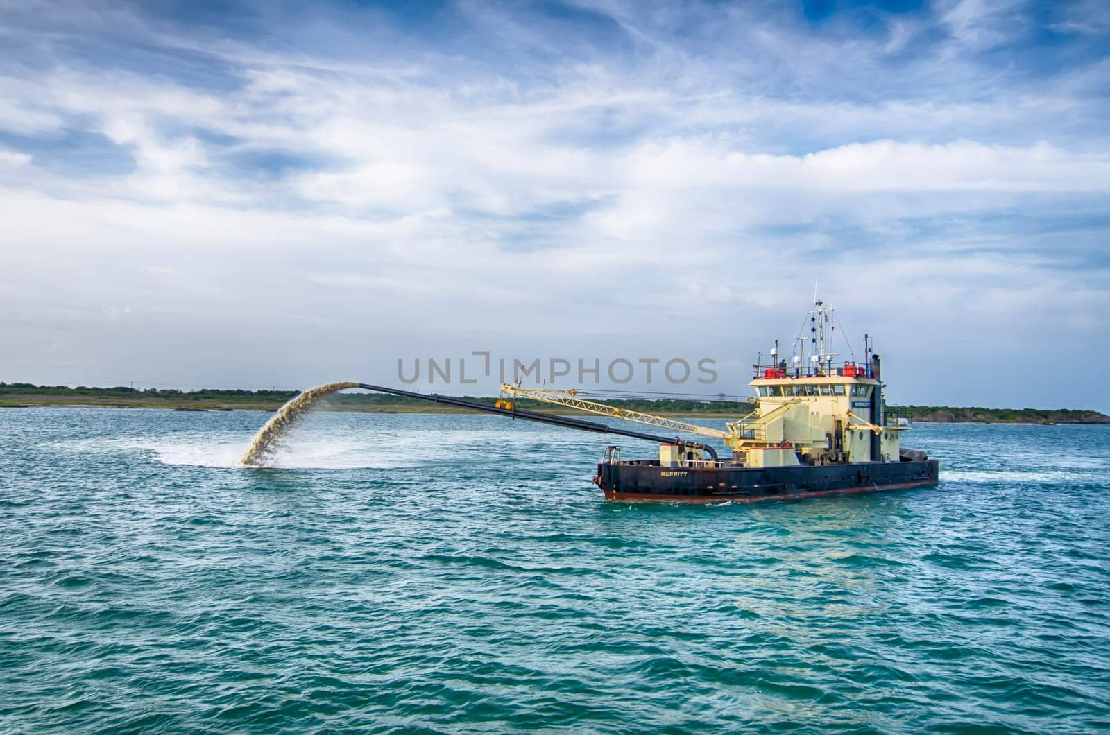 Barge Pipe pushing sand onto the beach