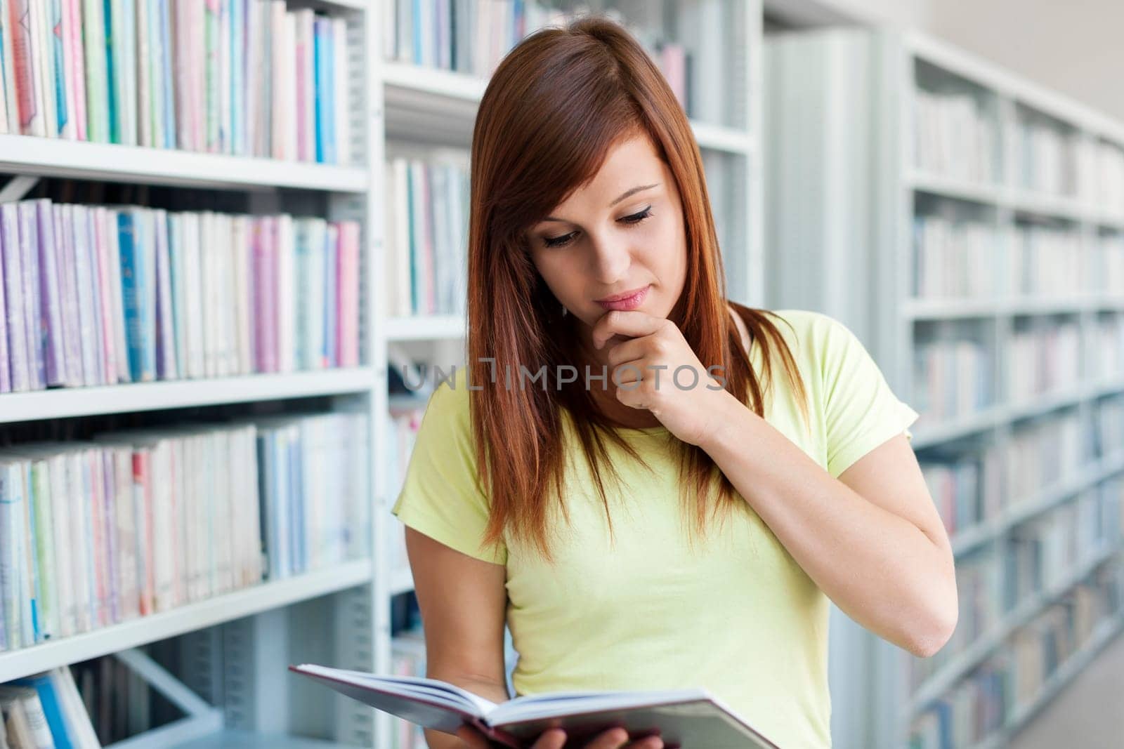 Student reading in library