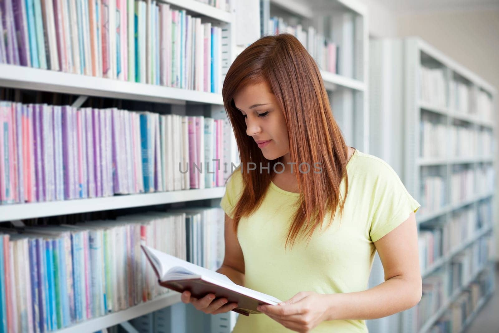 Student reading in library