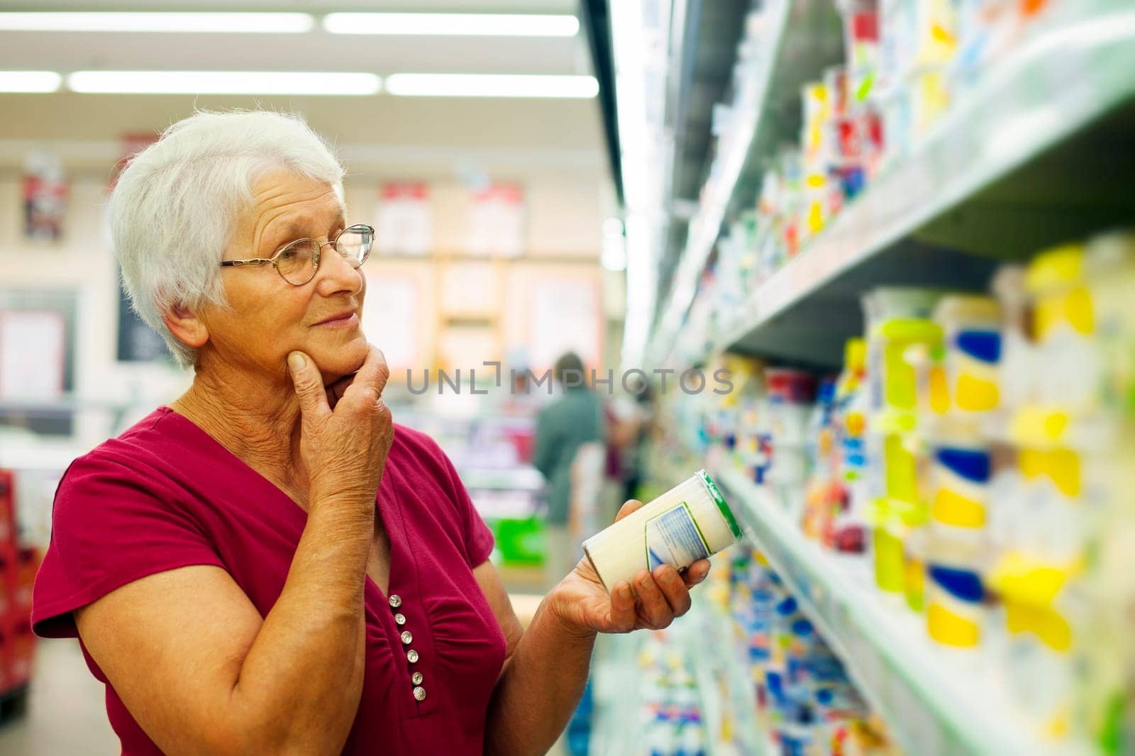 Senior woman at groceries store