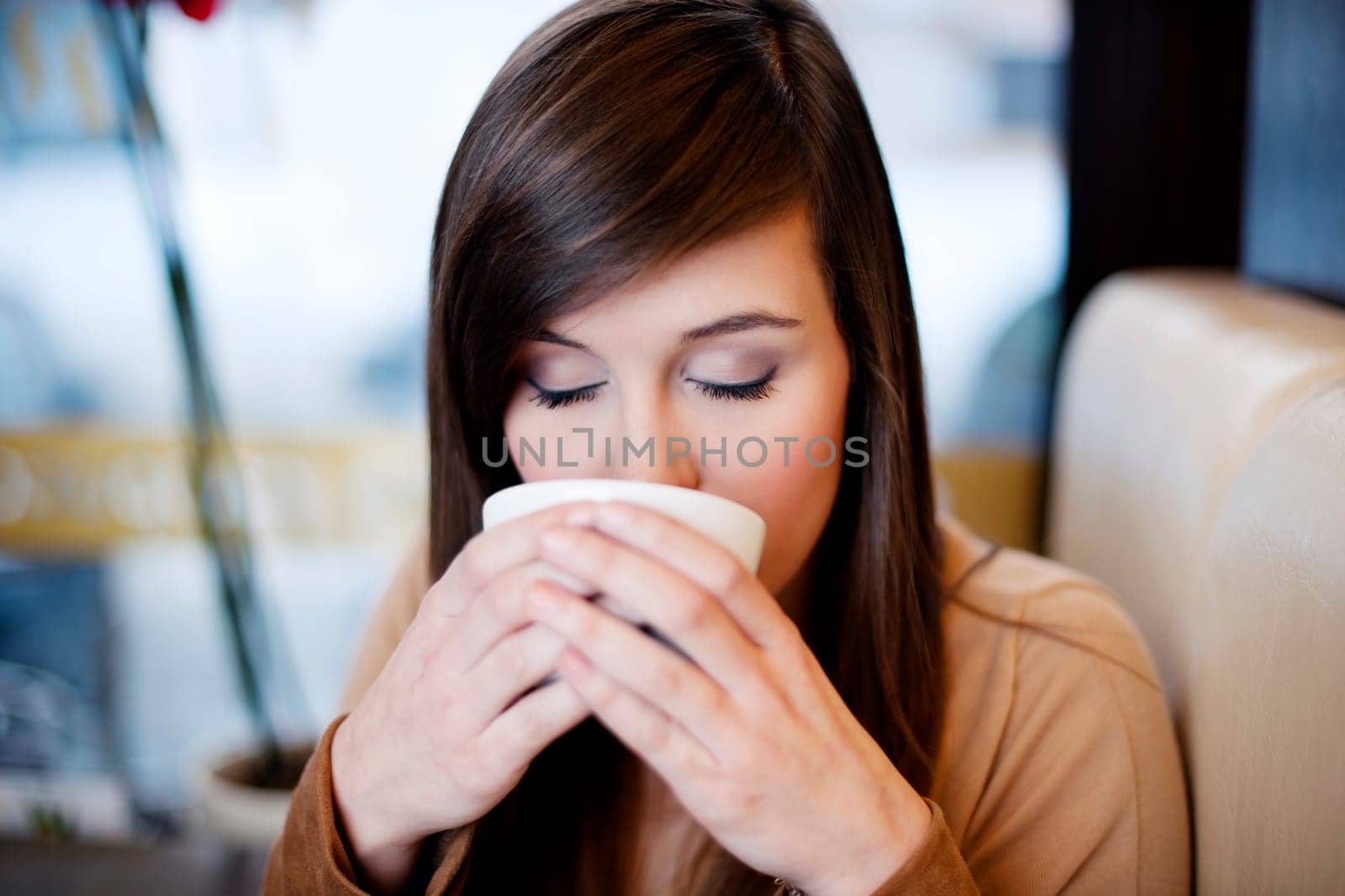Close up of woman drinking coffee