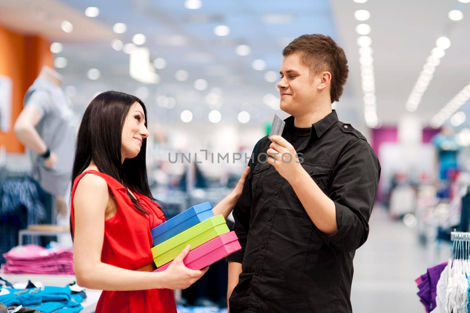 Man spoiling his girlfriend by buying her new clothes