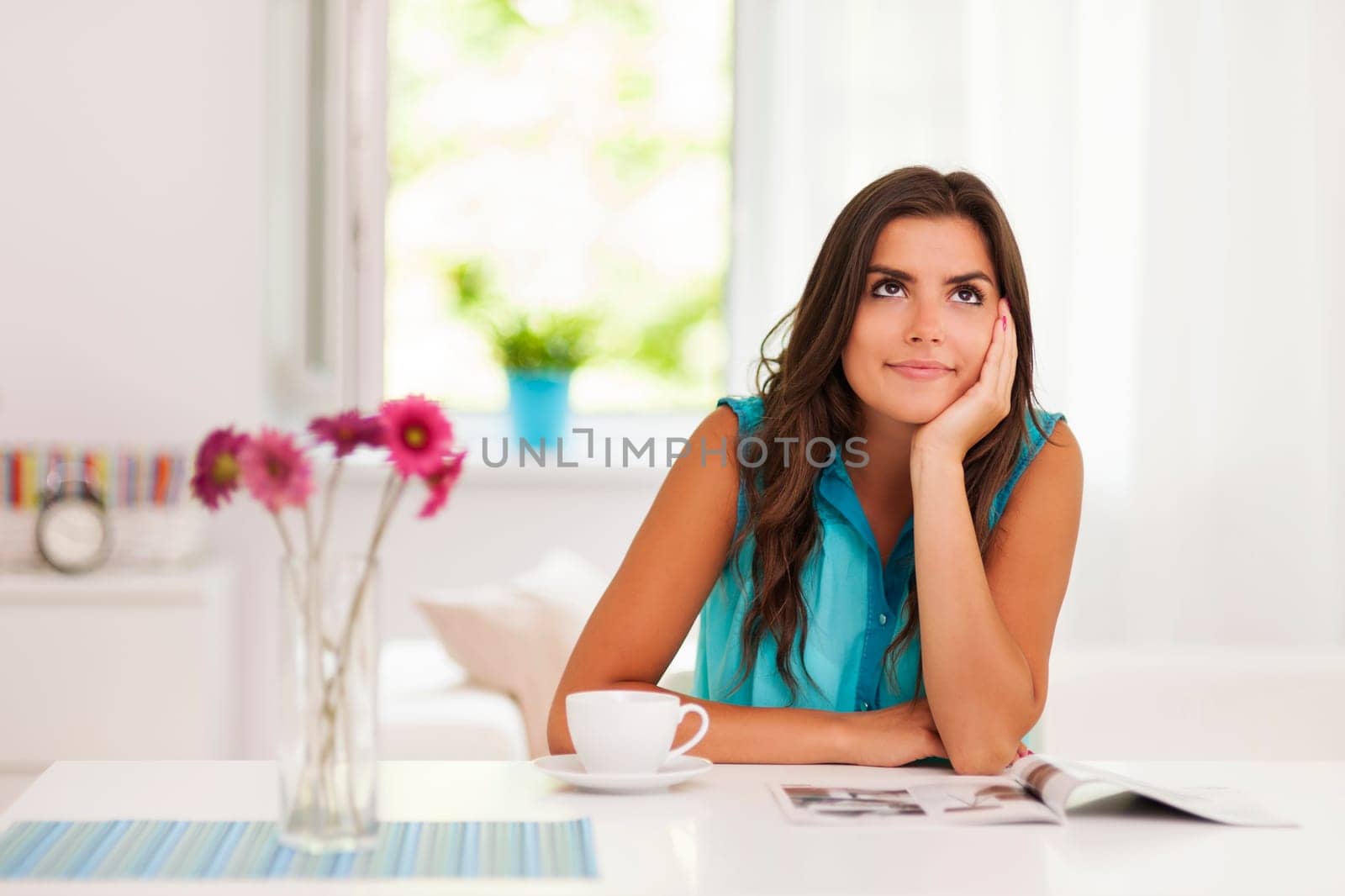 Beautiful woman relaxing in living room