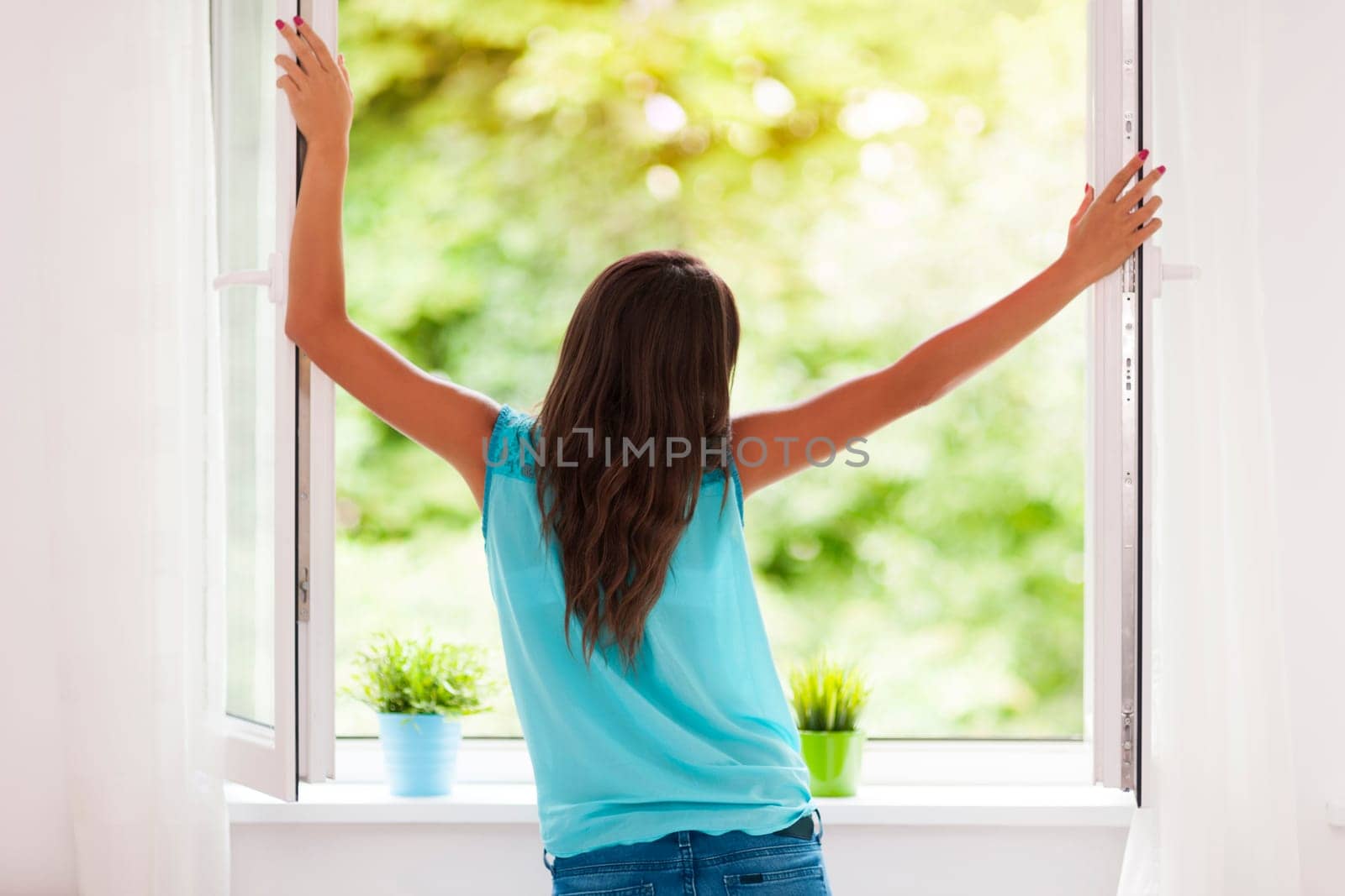 Young woman breathing fresh air during the summer