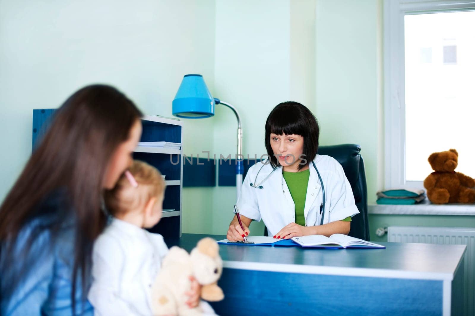 Mother and baby girl at the doctors office