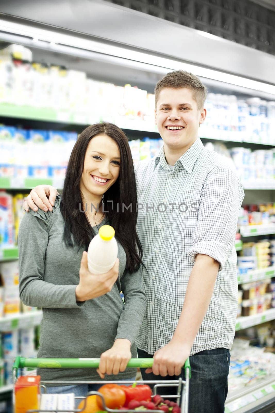 Young couple shopping at supermarket