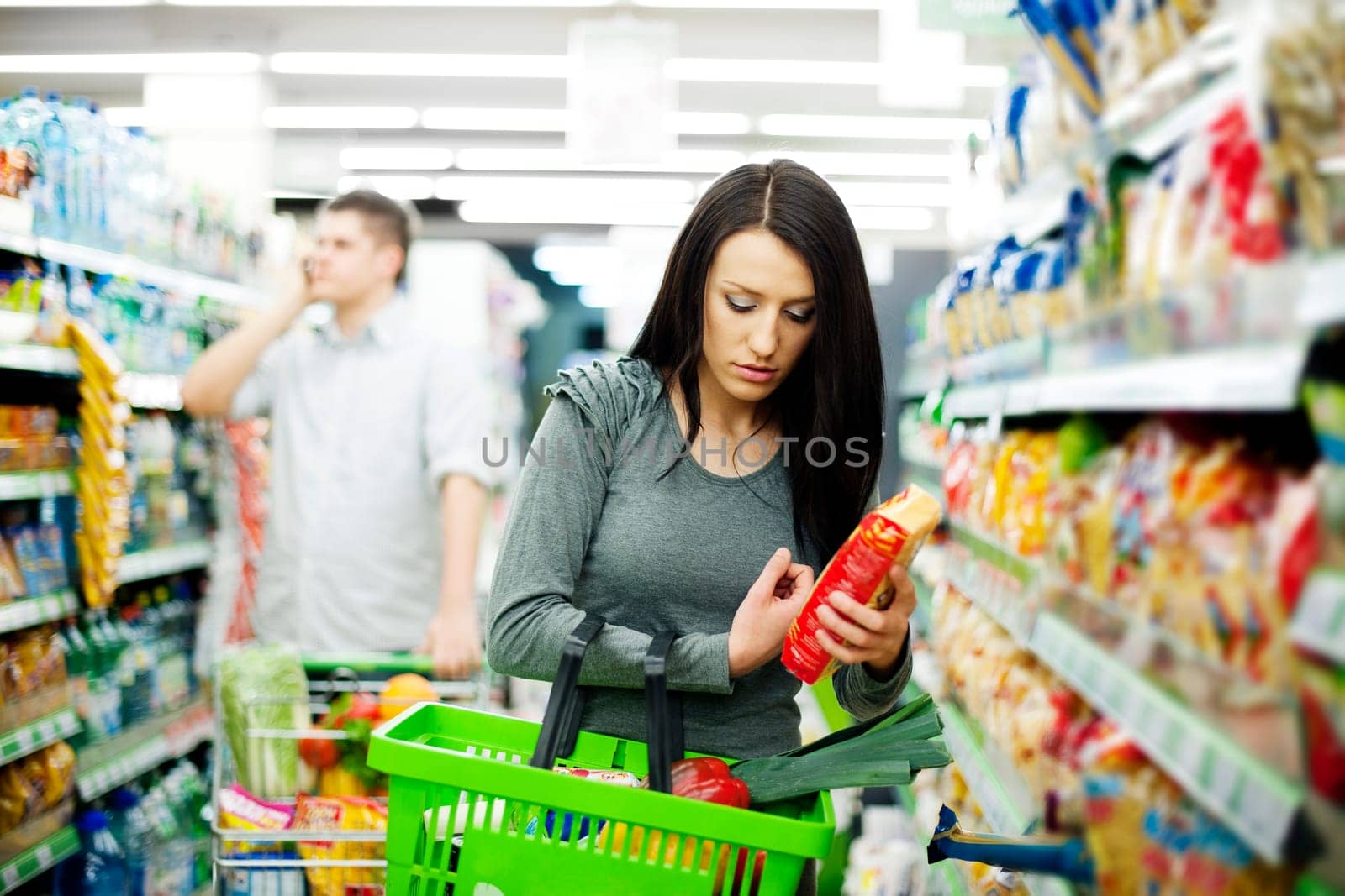 Young couple shopping at supermarket