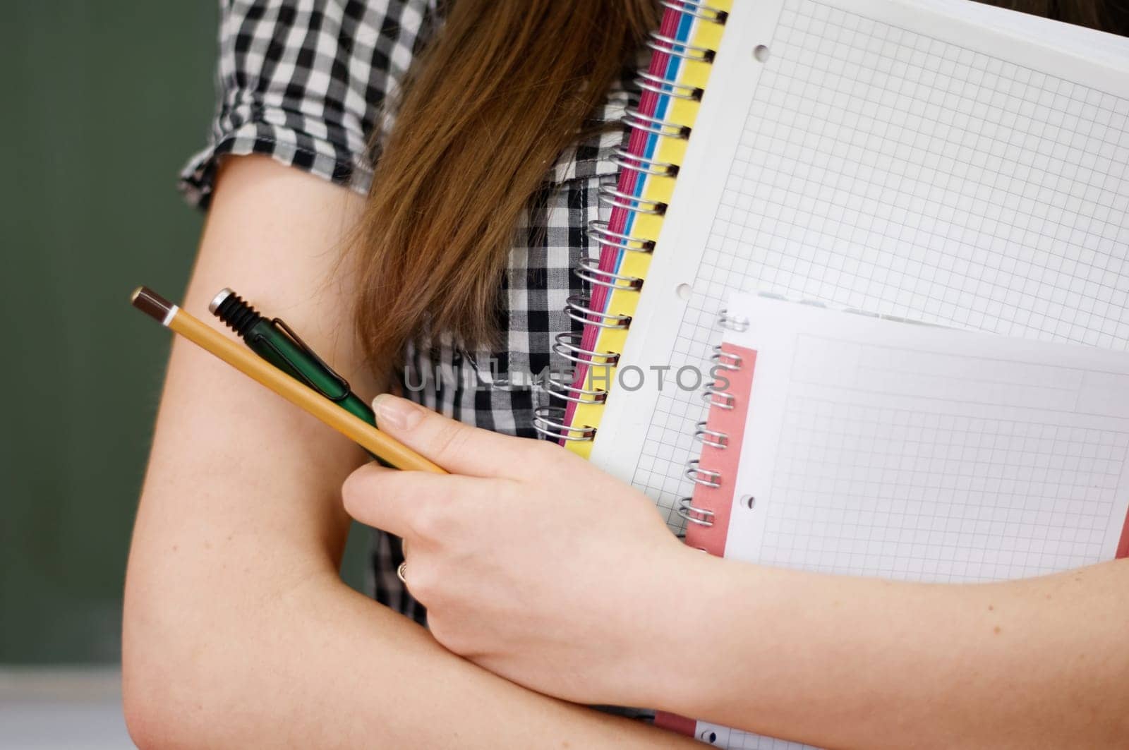 Student girl holding notebooks