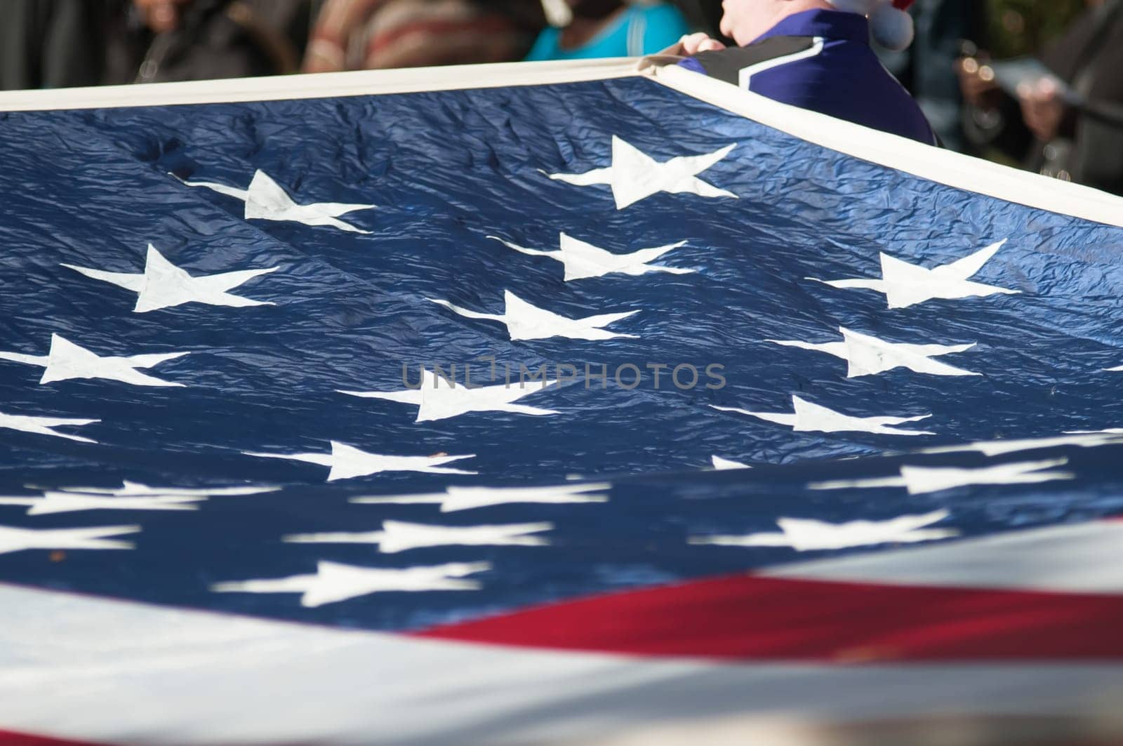 american flag carried at the parade