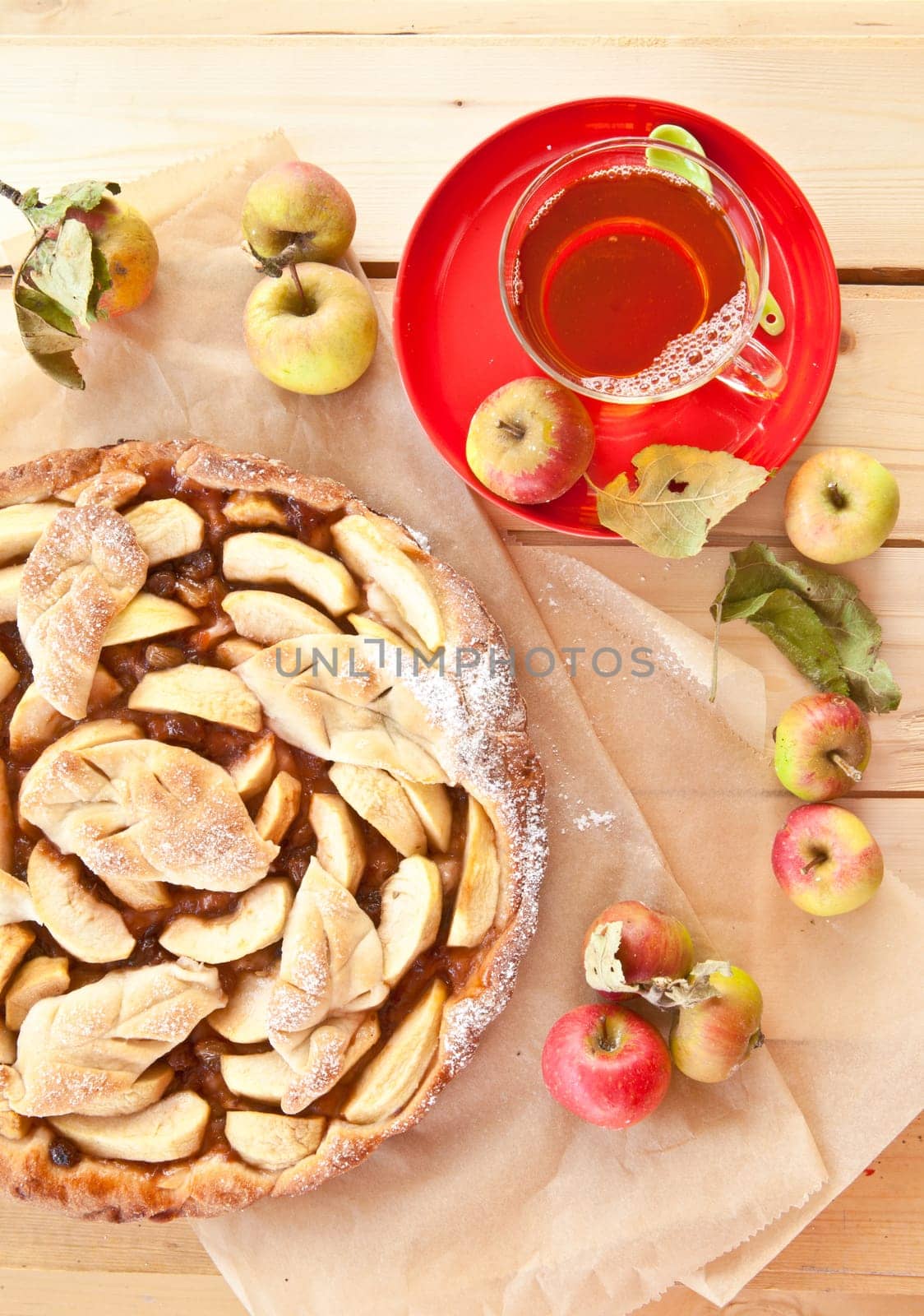 Homemade apple pie with organic apple chimes and tea