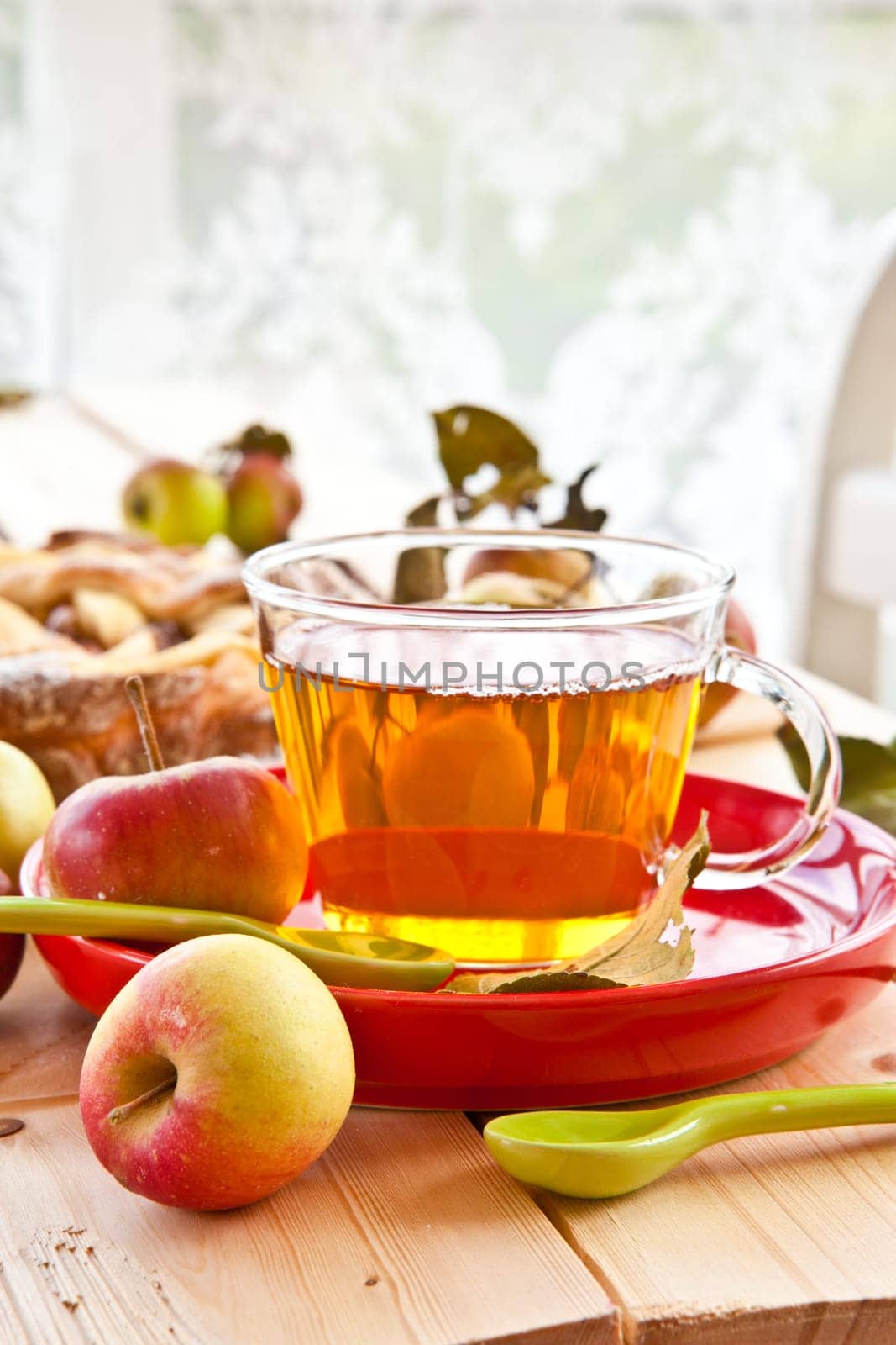 Organic fruechtetee with apple in glass cup