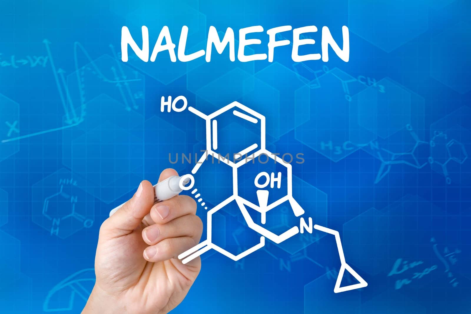 Hand with pen draws chemical structural formula of nalmefen