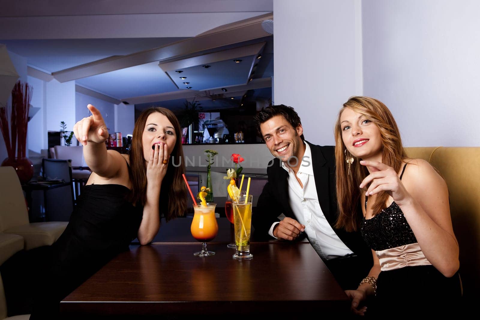 Group of friends enjoying show. Focus on women on the left
