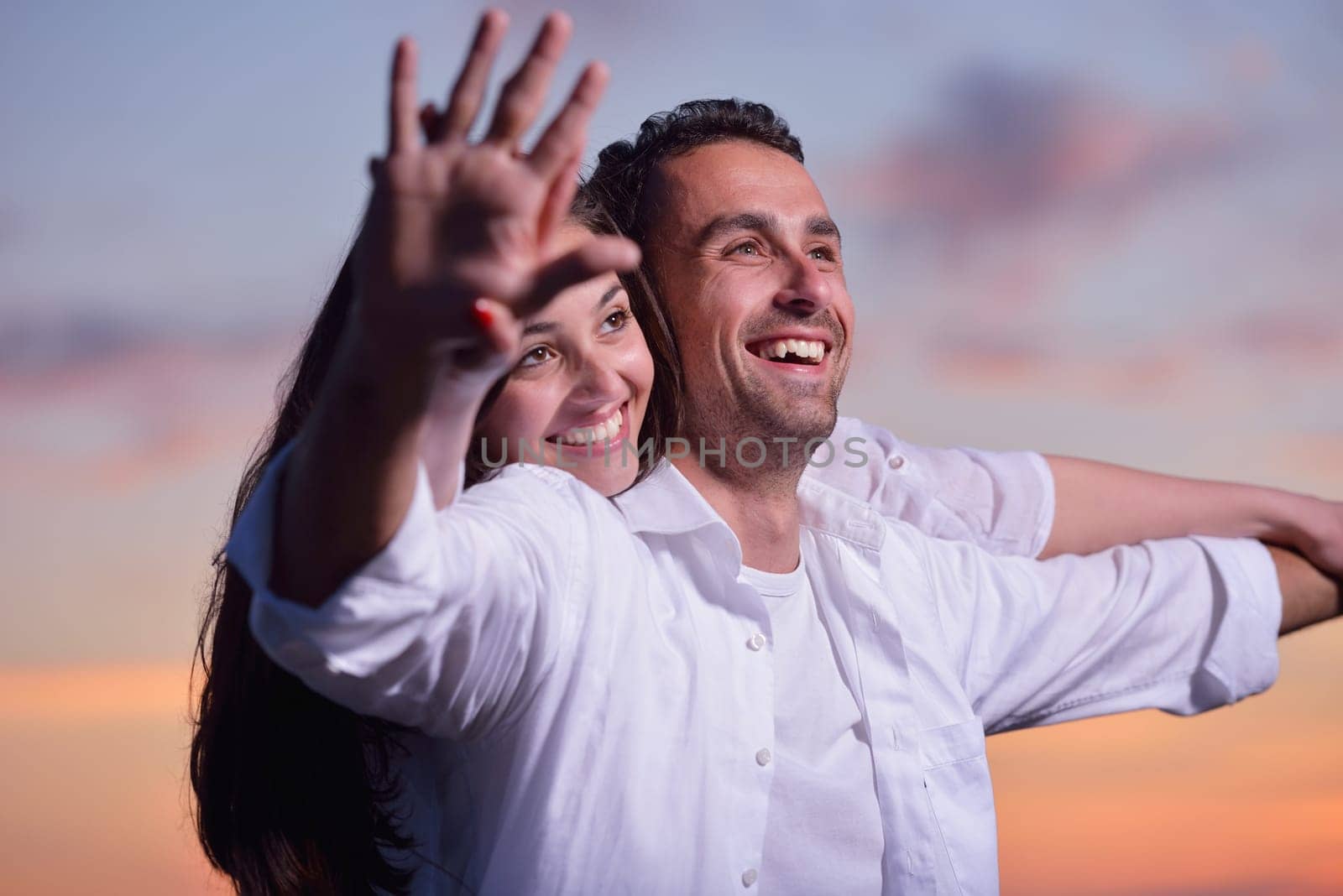 happy young romantic couple in love have fun on beautiful beach at beautiful summer day