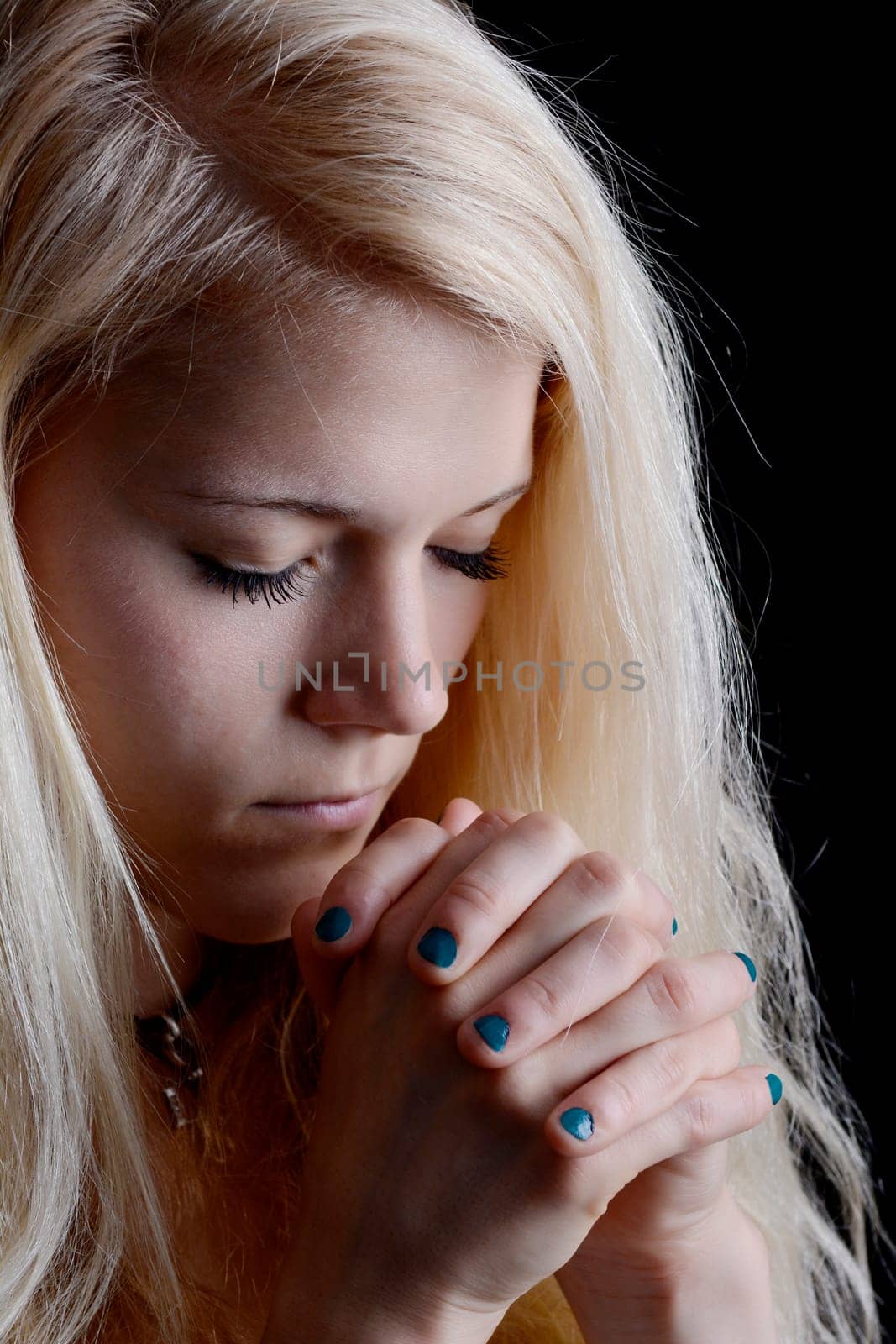 young woman prays