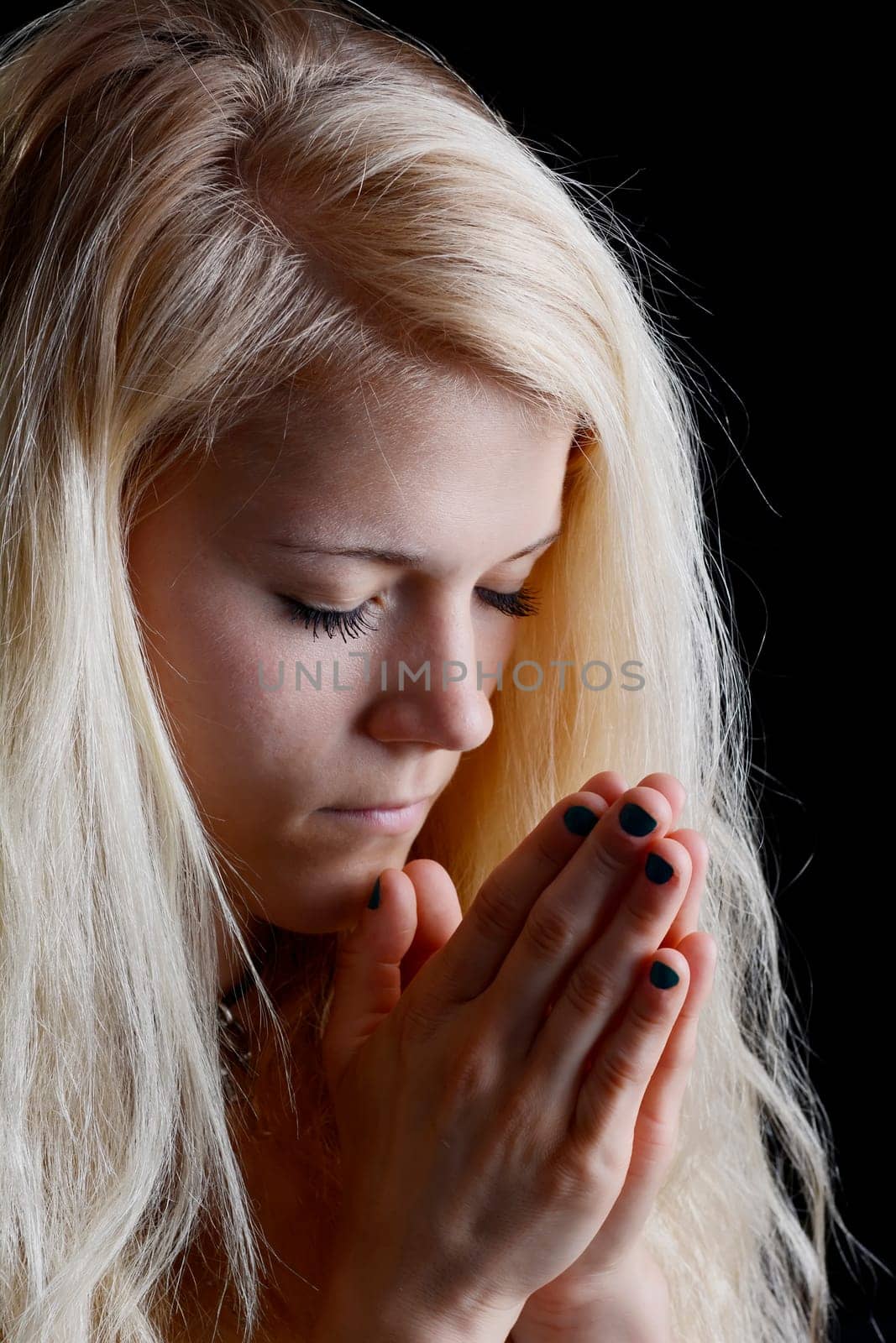 young woman prays