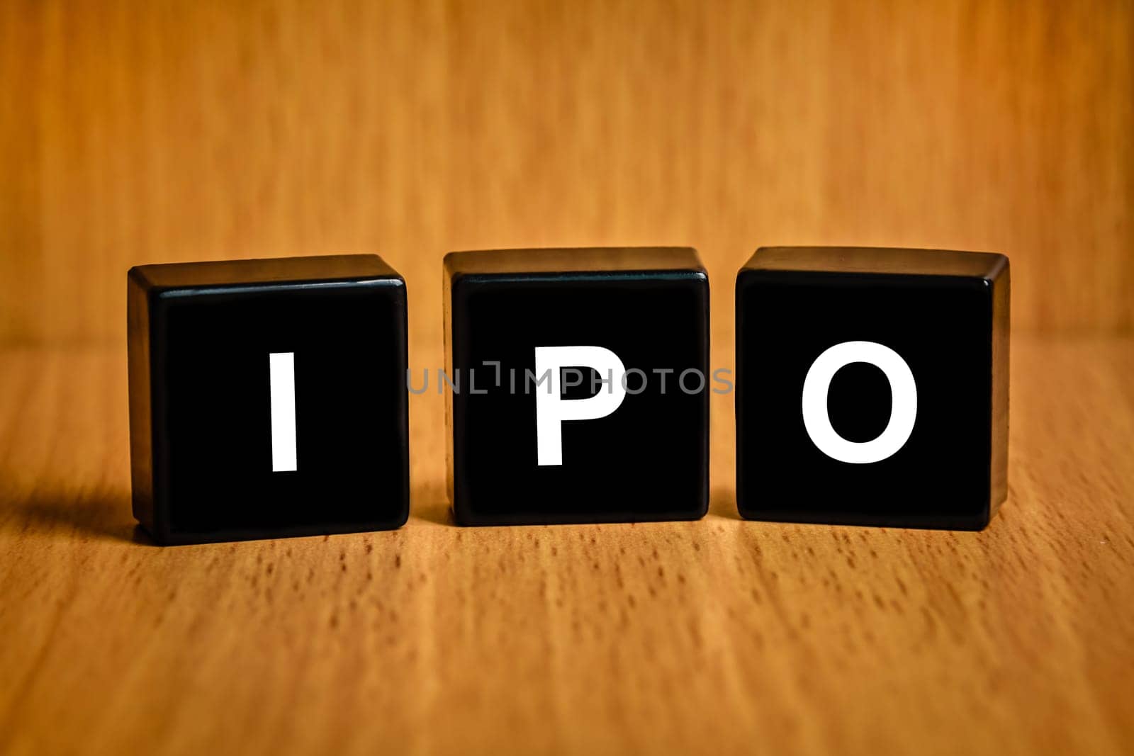 IPO or Initial public offering text on black block