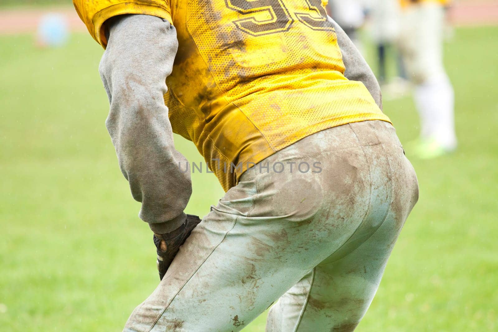 American football game in rain