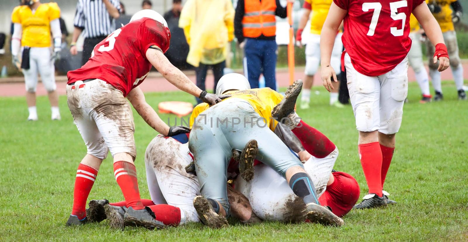 American football game in rain