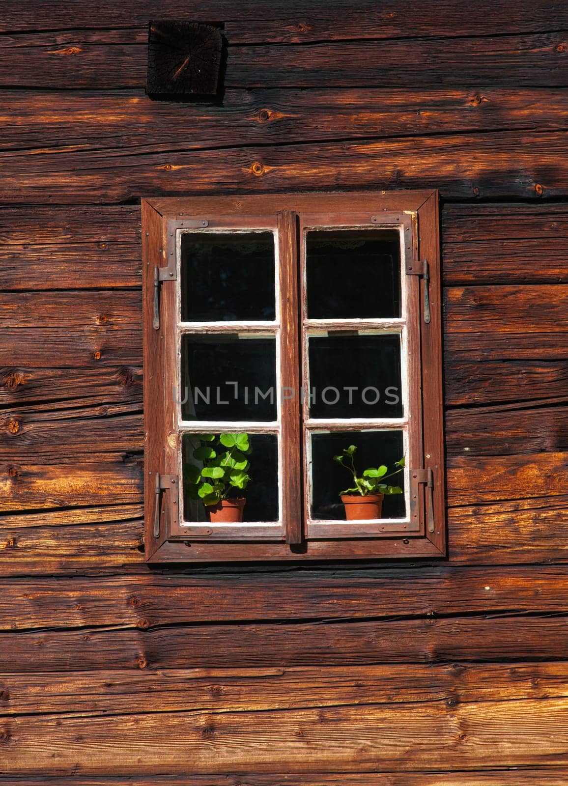 Wooden house facade with window