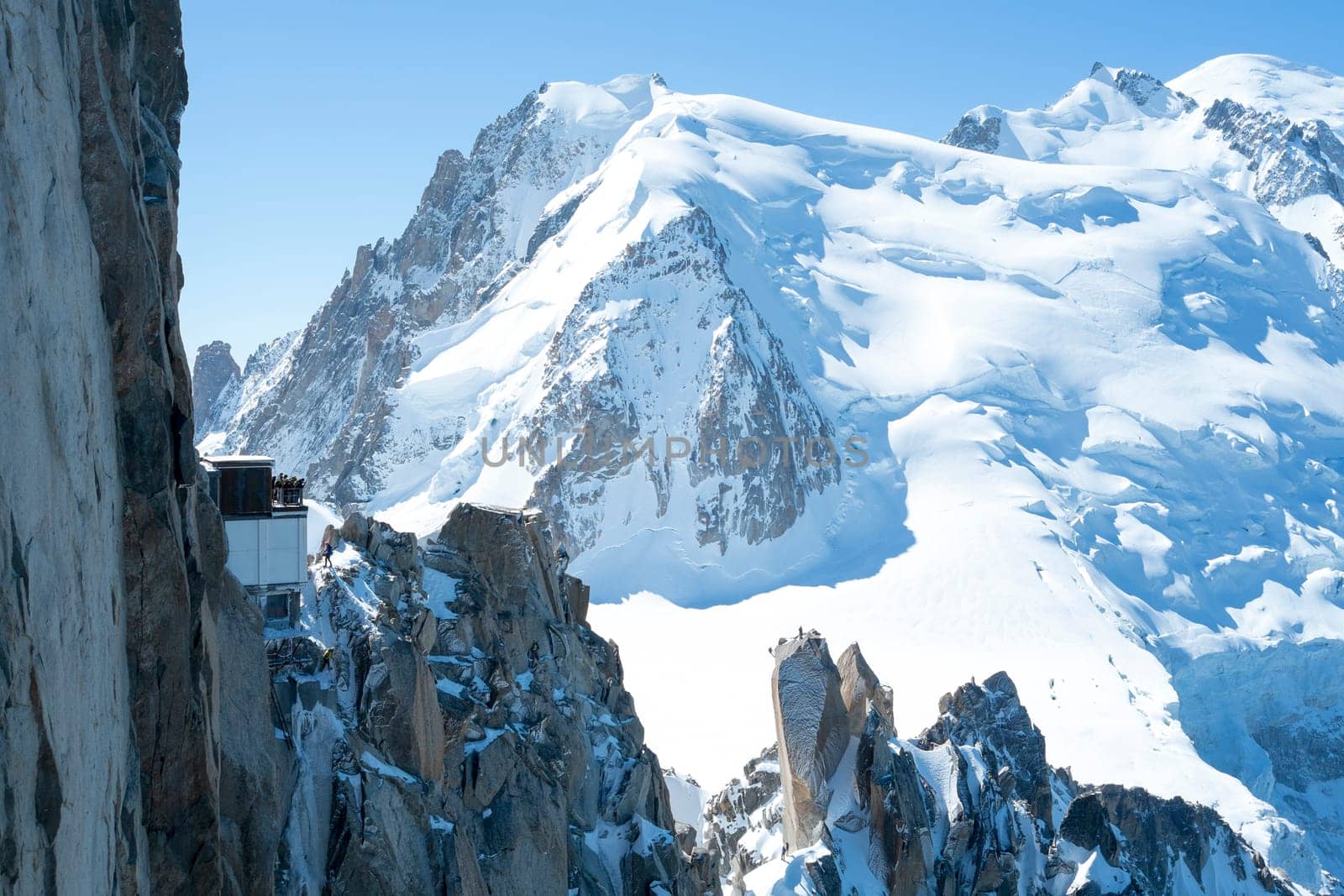 Mont Blanc mountain range, In Chamonix, France, with climbers on its rocks