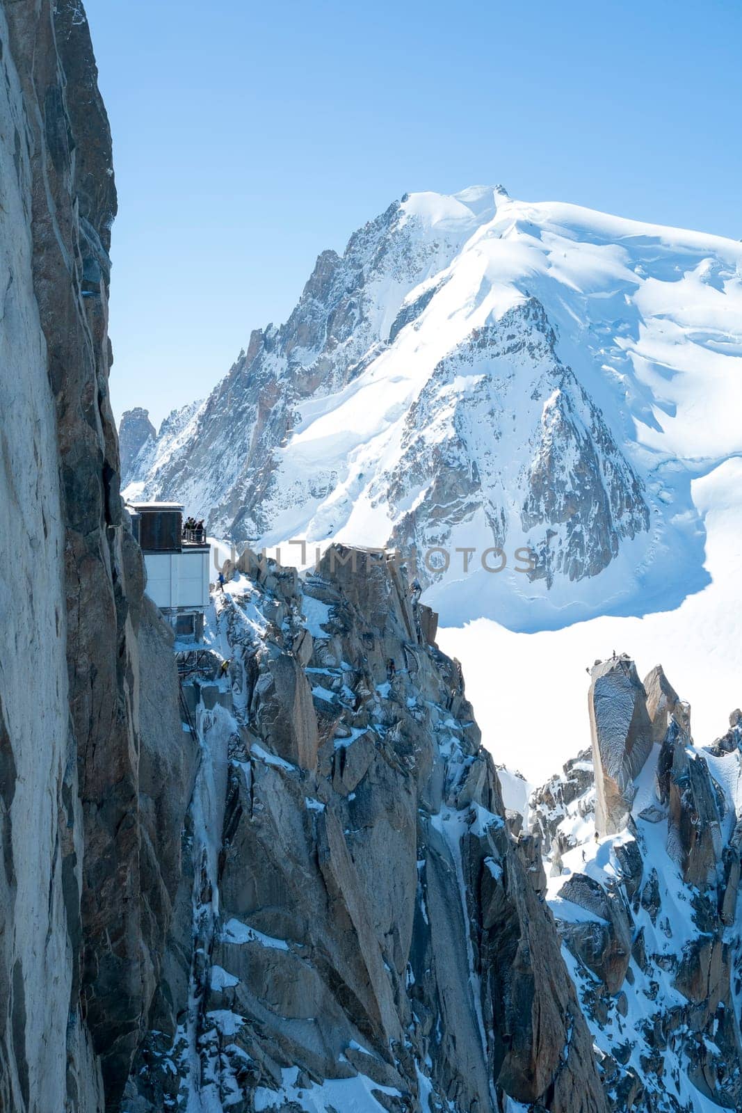 Mont Blanc mountain range, In Chamonix, France, with climbers on its rocks