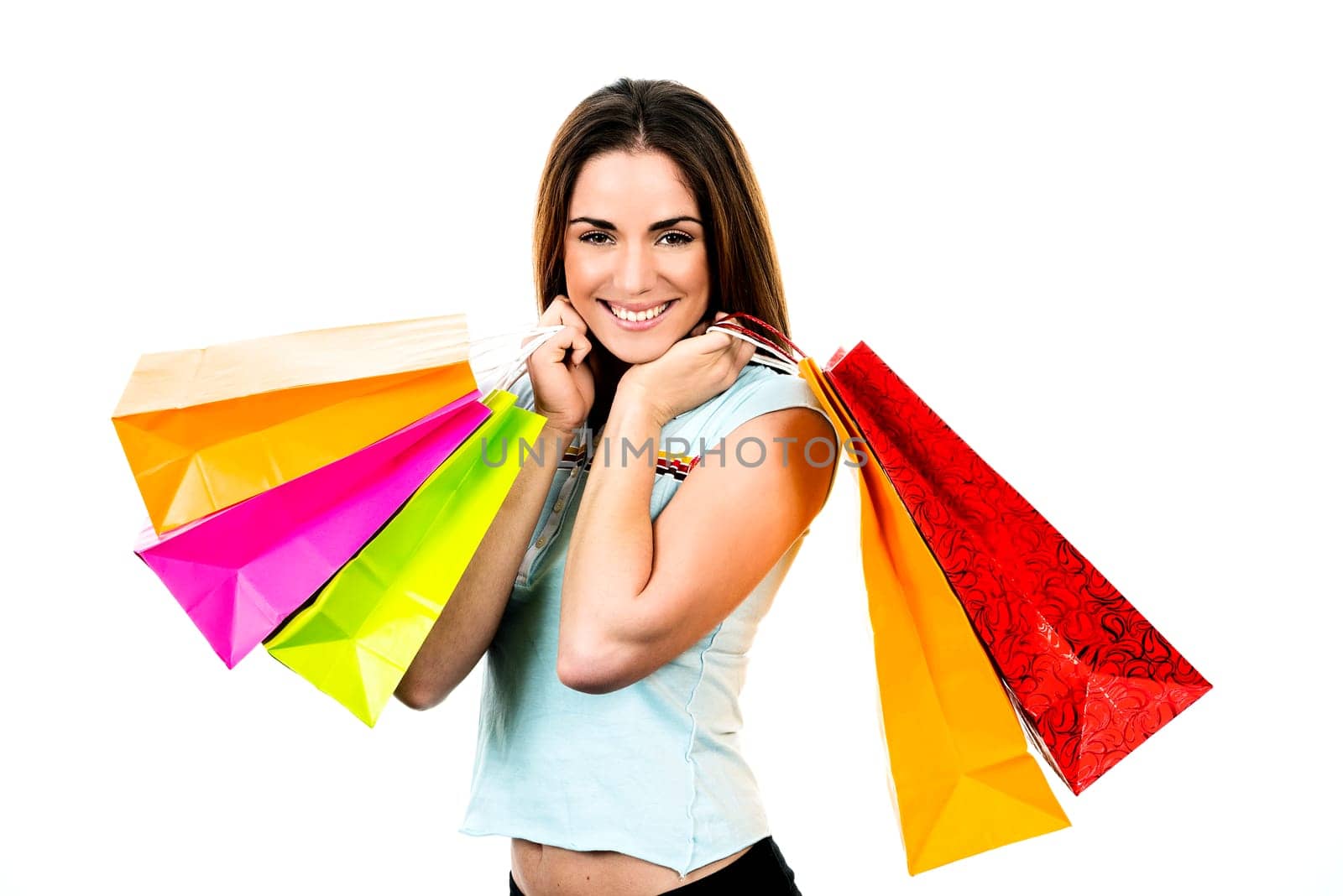 portrait young adult girl with colored bags