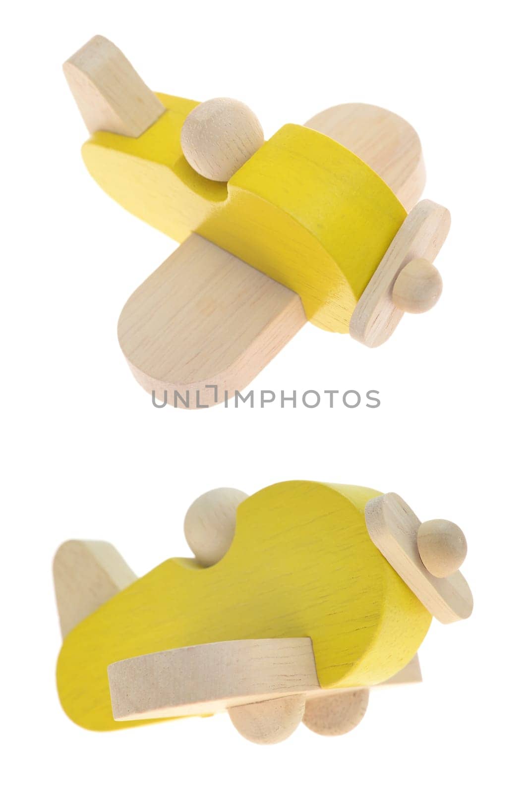 A close up shot of a toy wooden plane