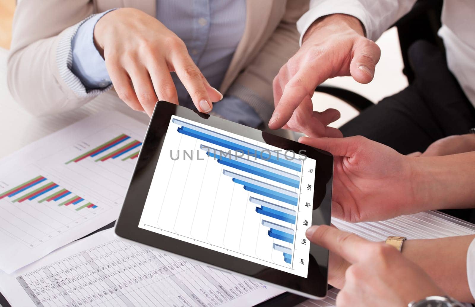 Close Up Of Business People Working Together In Office