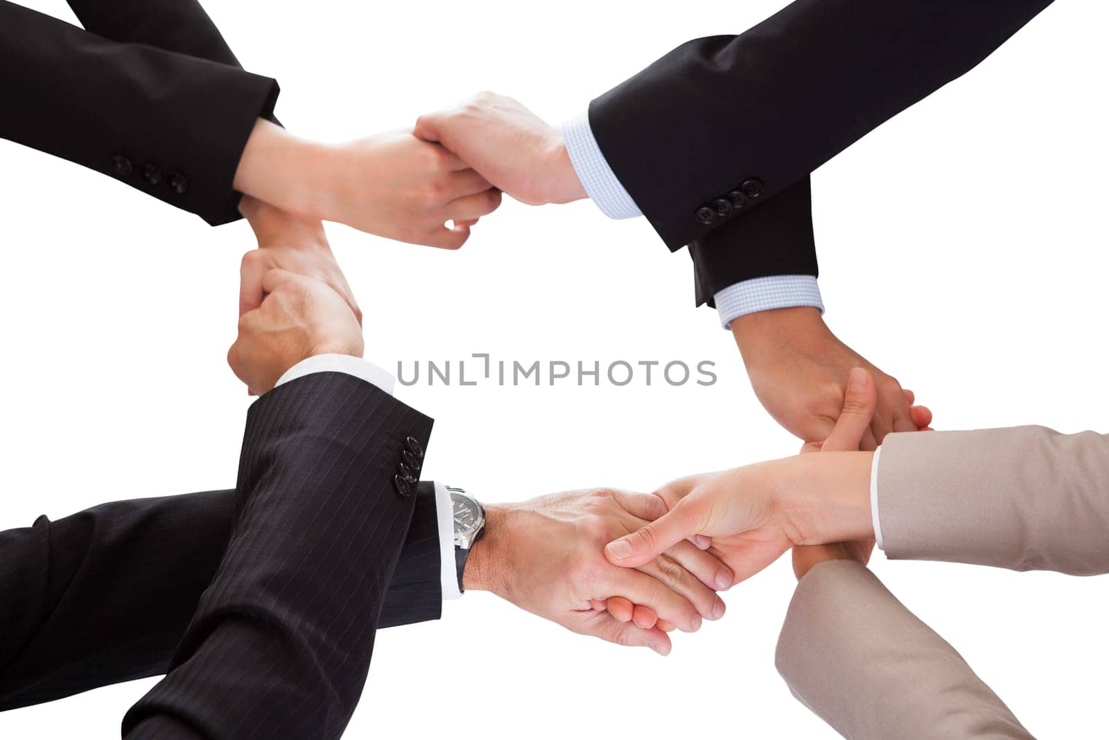 Close-up Of Businesspeople Hand Holding Together Over White Background