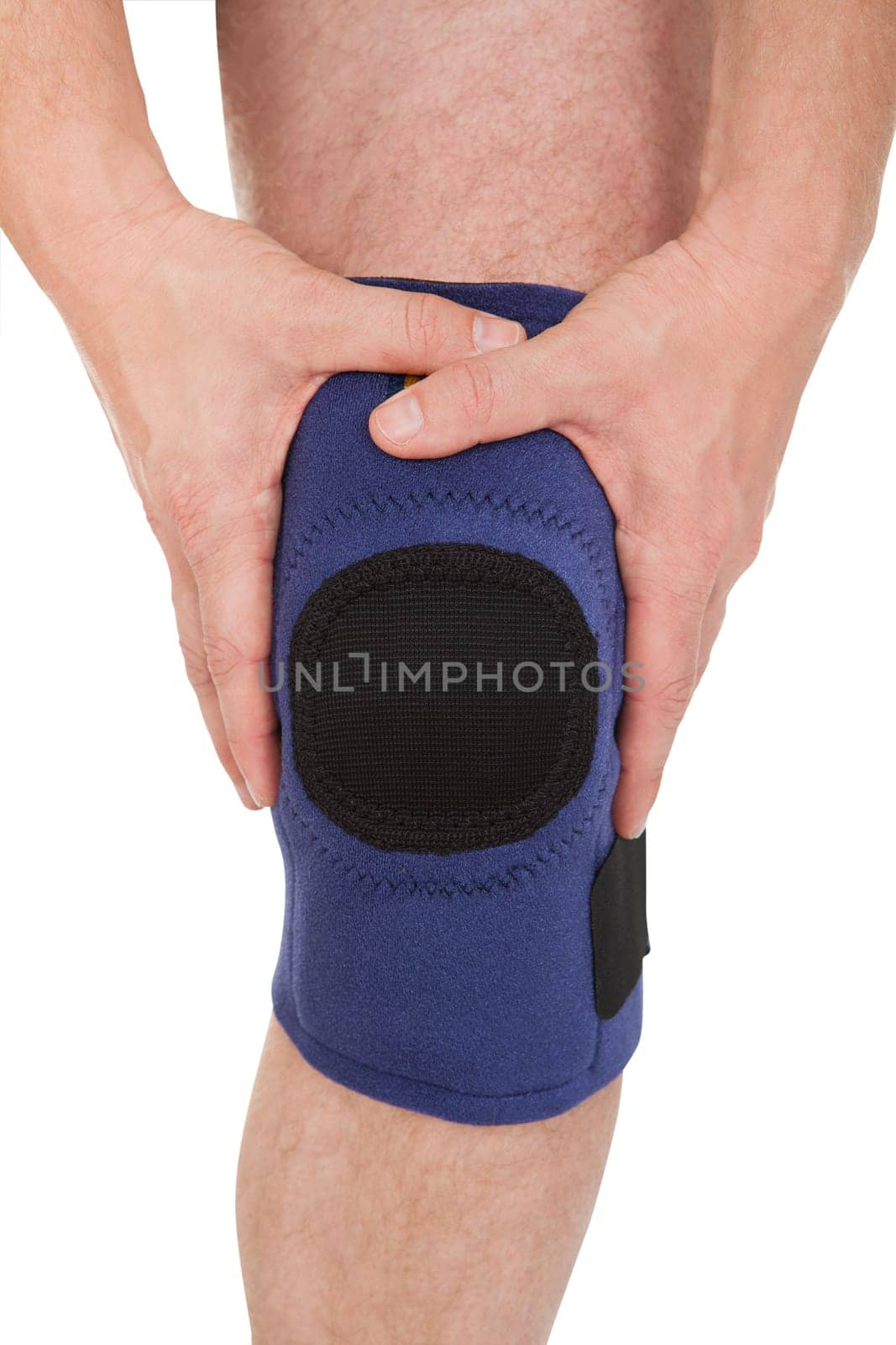 Close-up Of A Man Wearing Knee Brace Over White Background