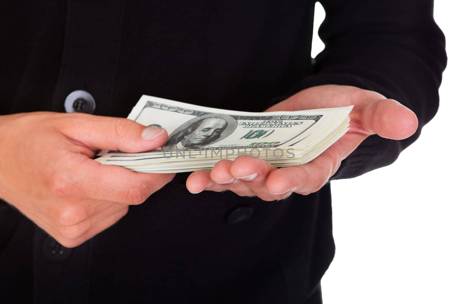 Close-up Of A Burglar Holding Money Isolated On White Background