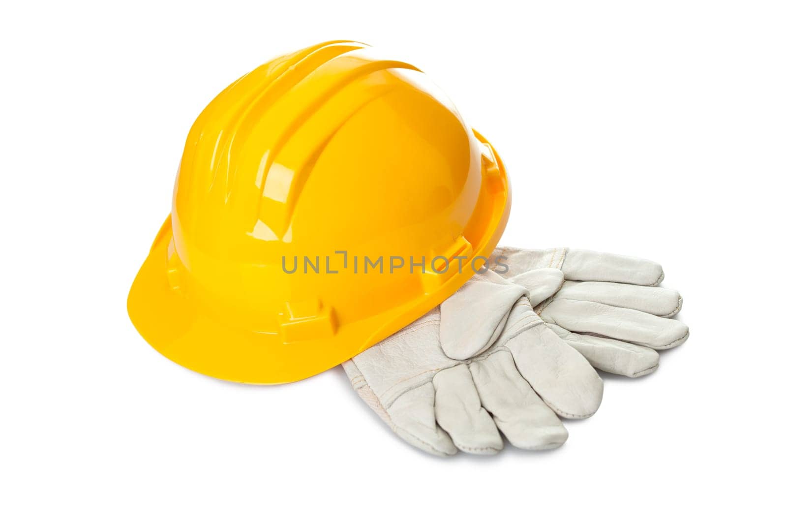 Safety yellow hard hat and industrial gloves isolated on white background