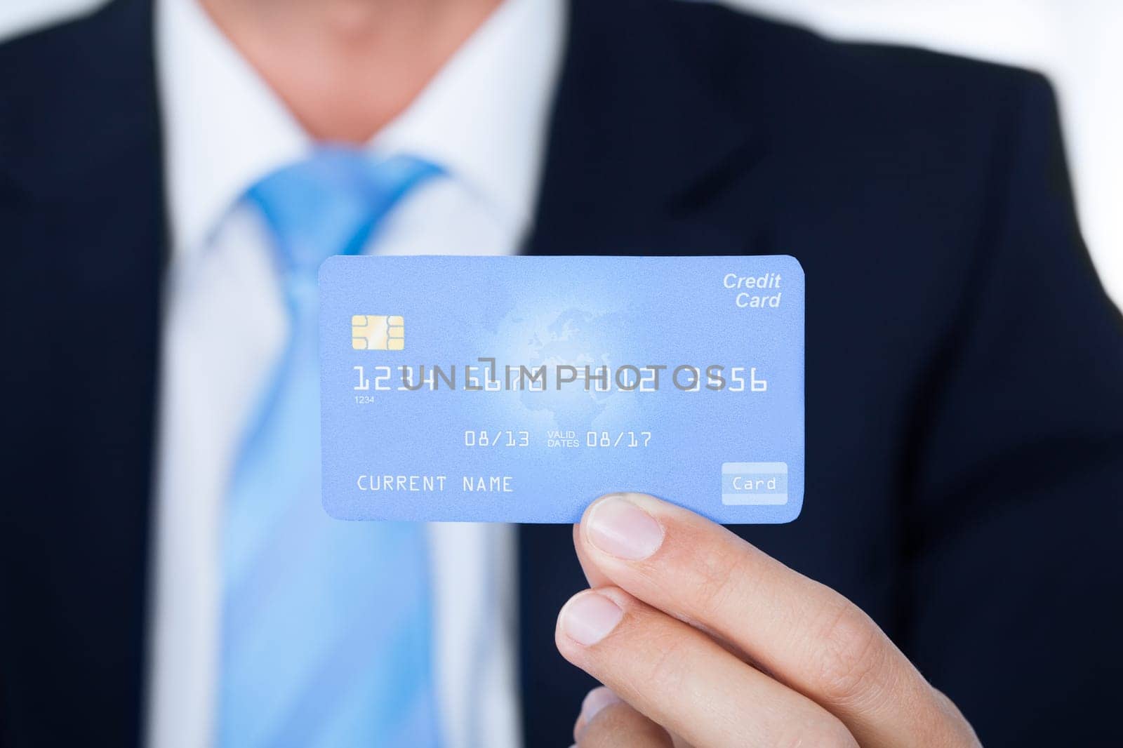 Portrait Of Young Happy Businessman Holding Credit Card