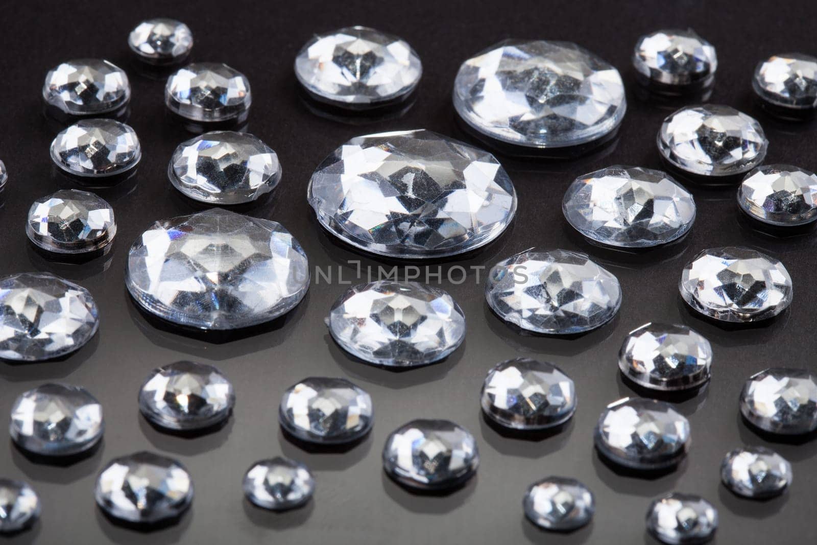 Close-up Of Diamonds Isolated Over Gray Background